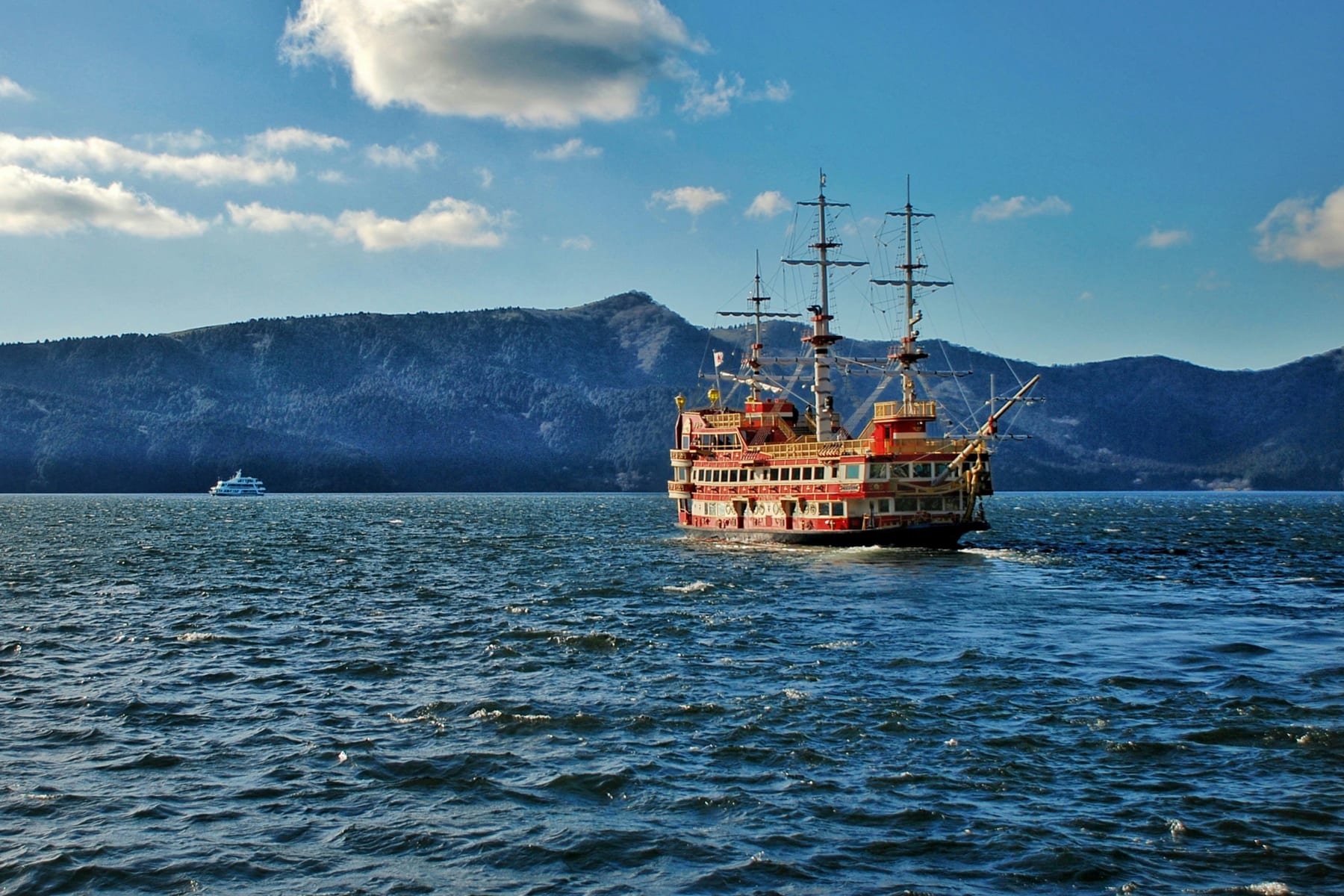 The Hakone pirate ship sightseeing cruise sailing across Lake Ashi with misty mountains behind
