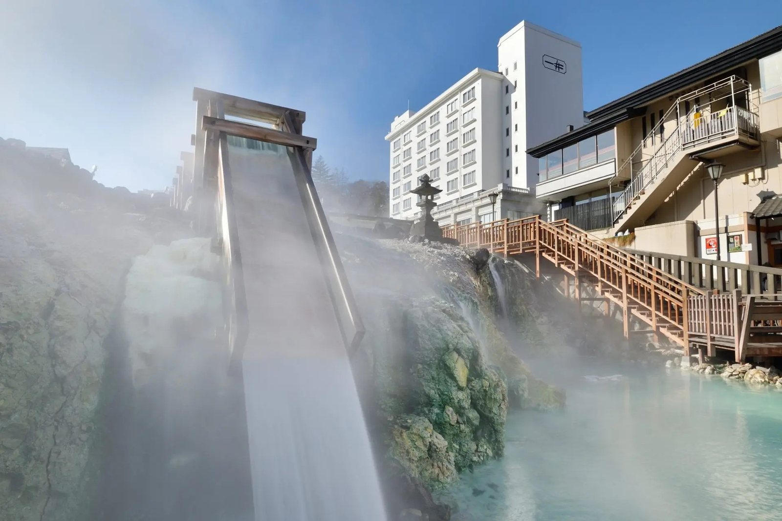 The Yubatake hot spring field in Kusatsu with Hotel Ichii beside it