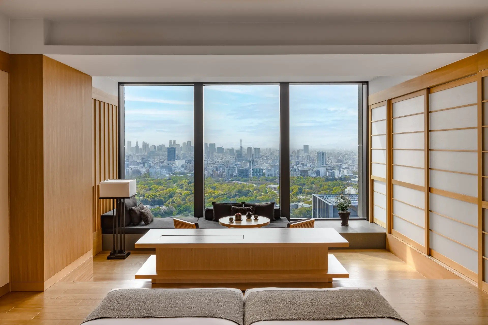 A guest room at Aman Tokyo with a view over the Imperial Palace gardens
