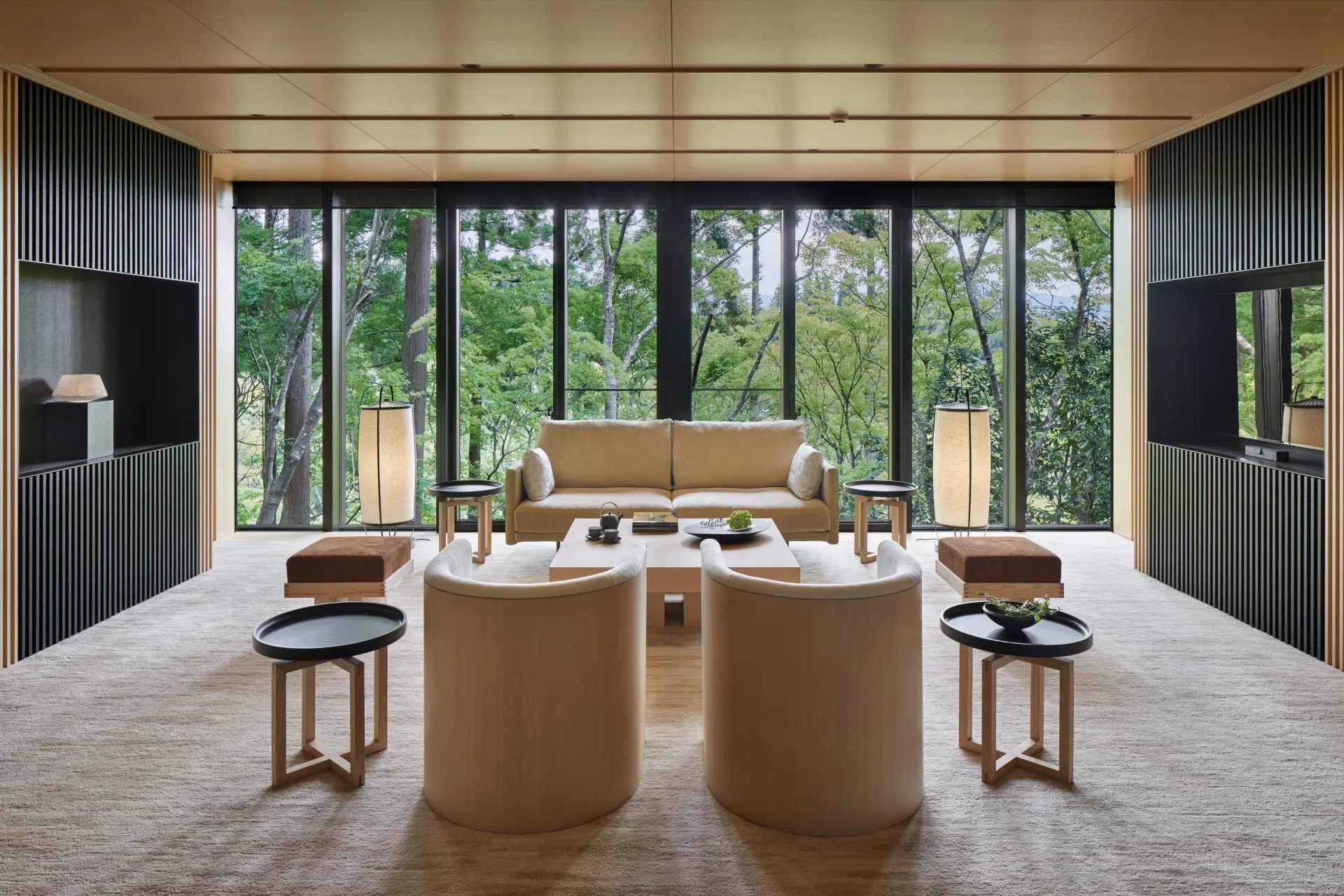 The living room of a pavilion at Aman Kyoto, opening onto the forest