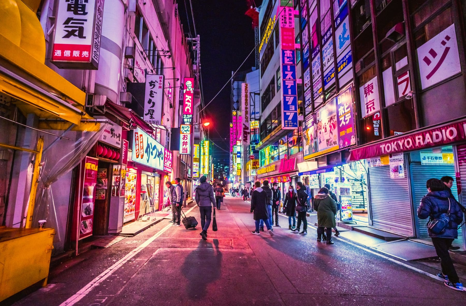 A neon-lit street in Tokyo at night